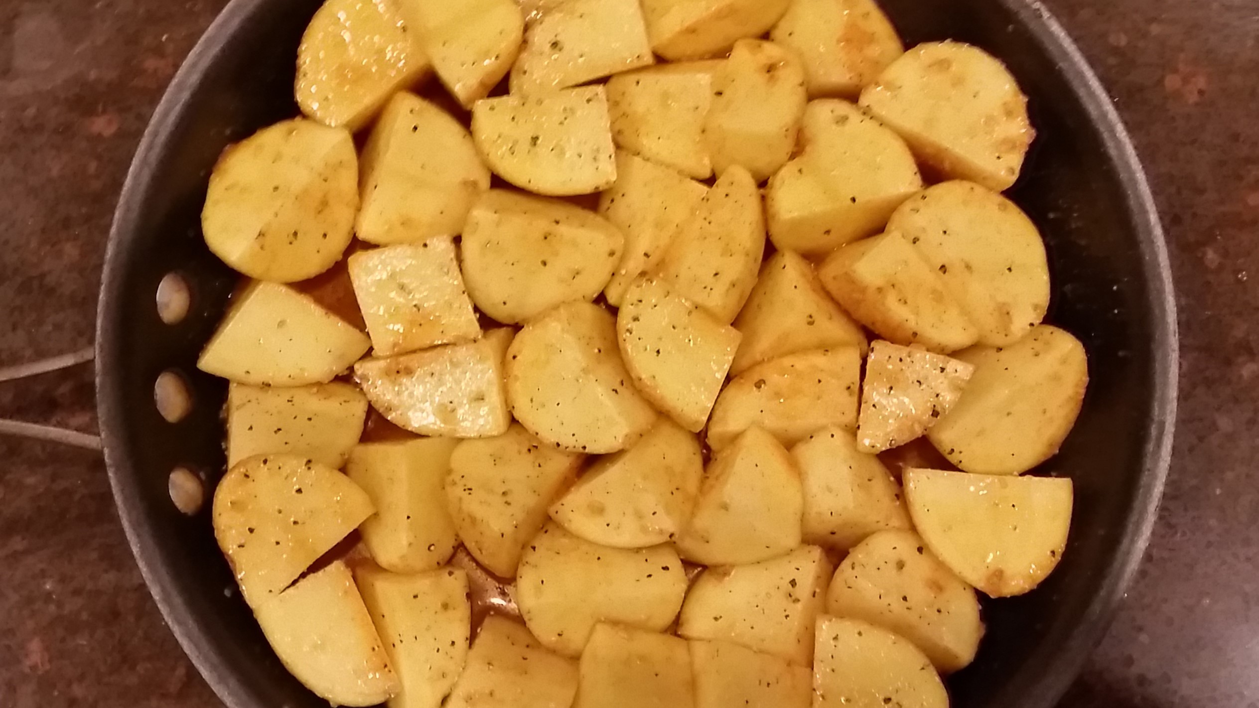 potatoes are marinated and ready for roasting