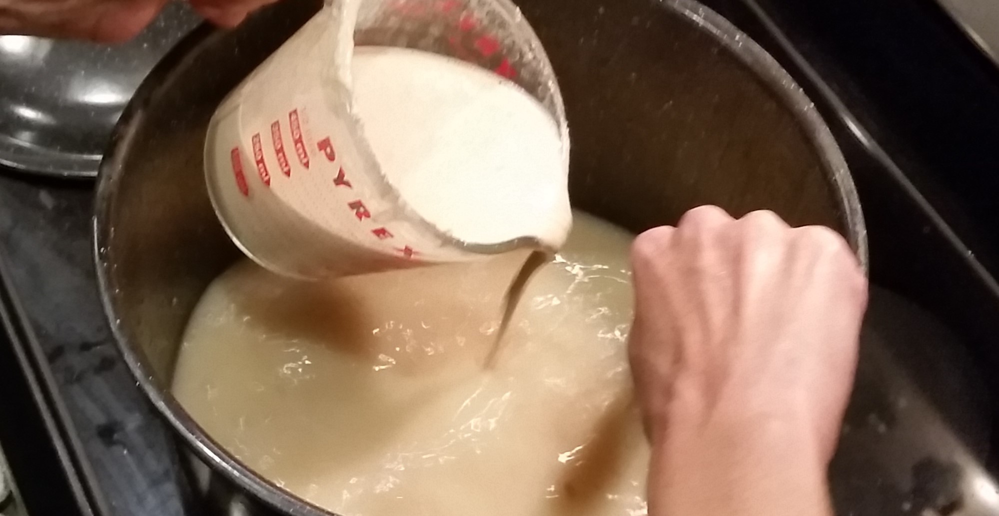 bone stock being thickened for dumplings
