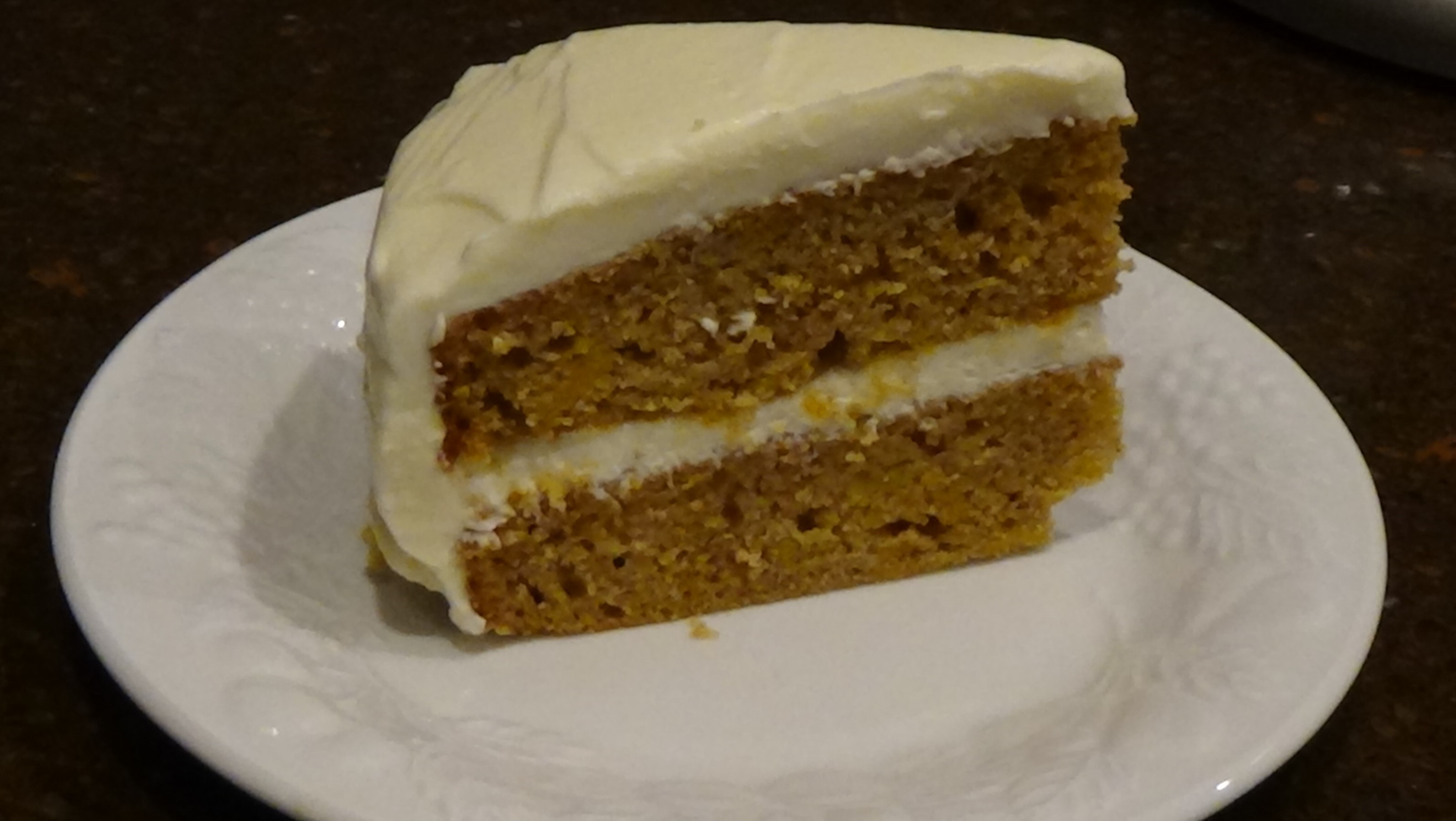pumpkin cake layered with butter cream cheese frosting
