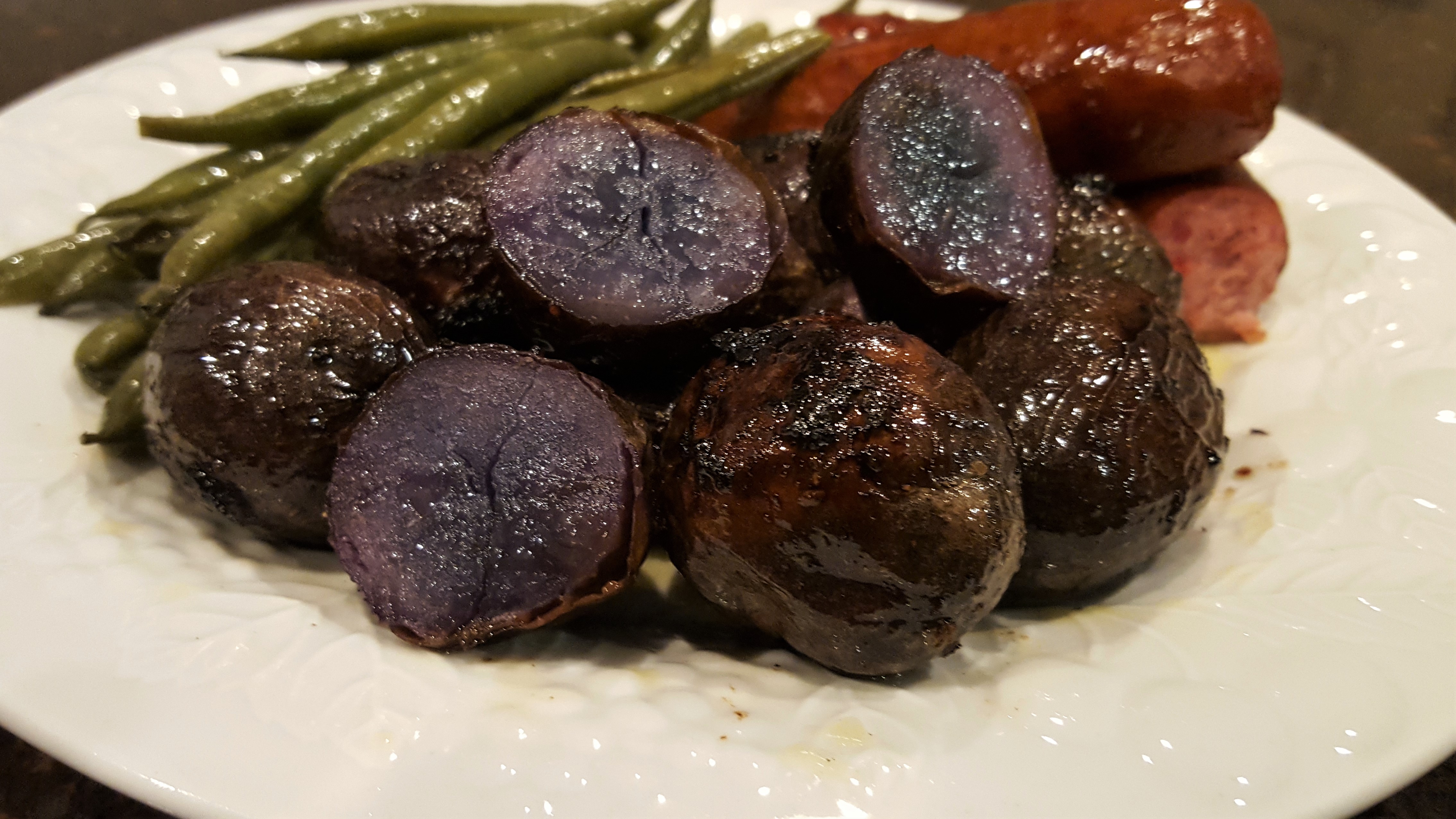 These Potatoes are Sweet and Creamy on the inside and Roasted crispiness on the outside! Healthier Purple Potatoes Roasted - Dining in with Danielle