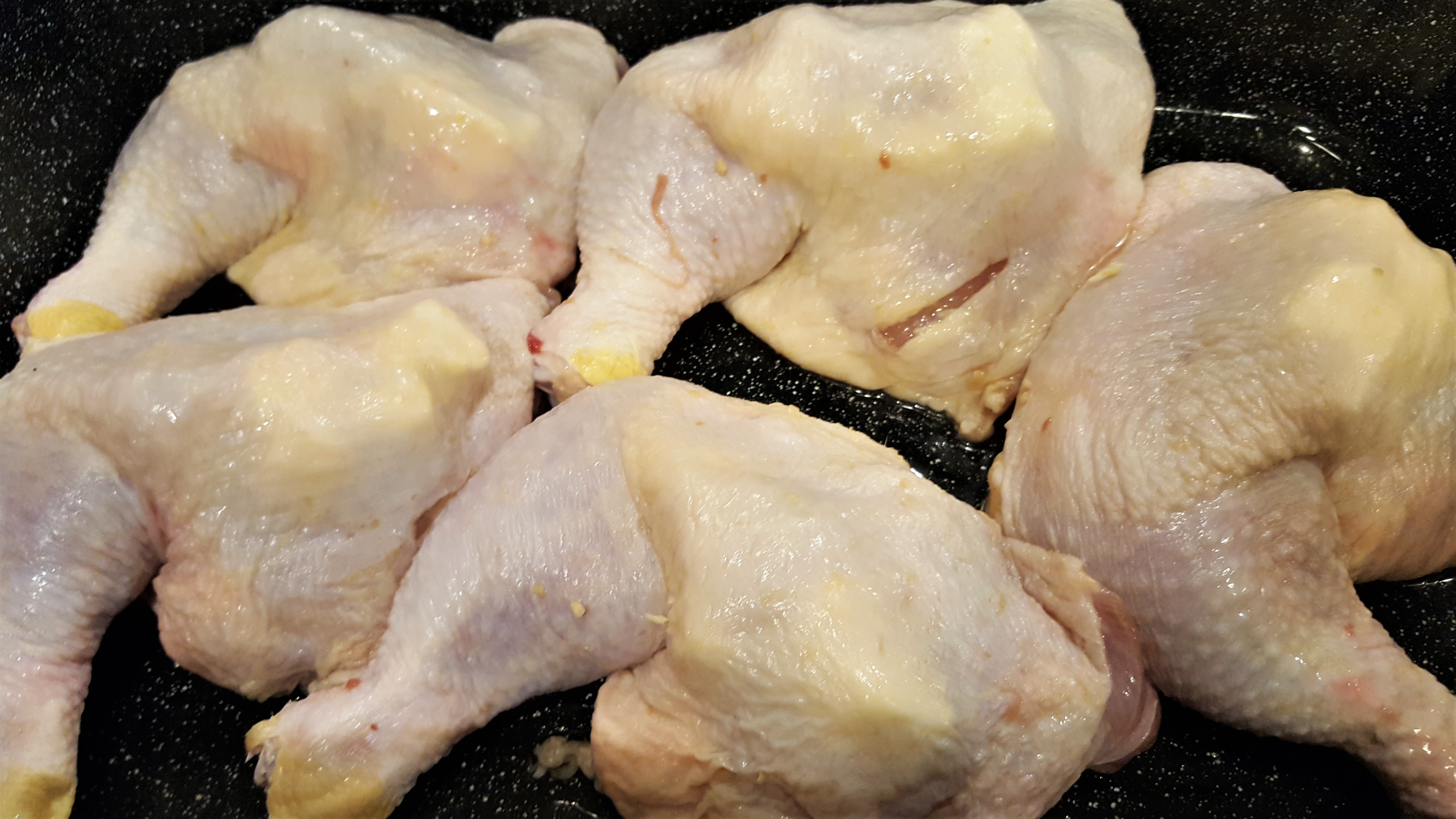 Stuffing Chicken Leg Quarters with Butter and Garlic - Dining in with Danielle
