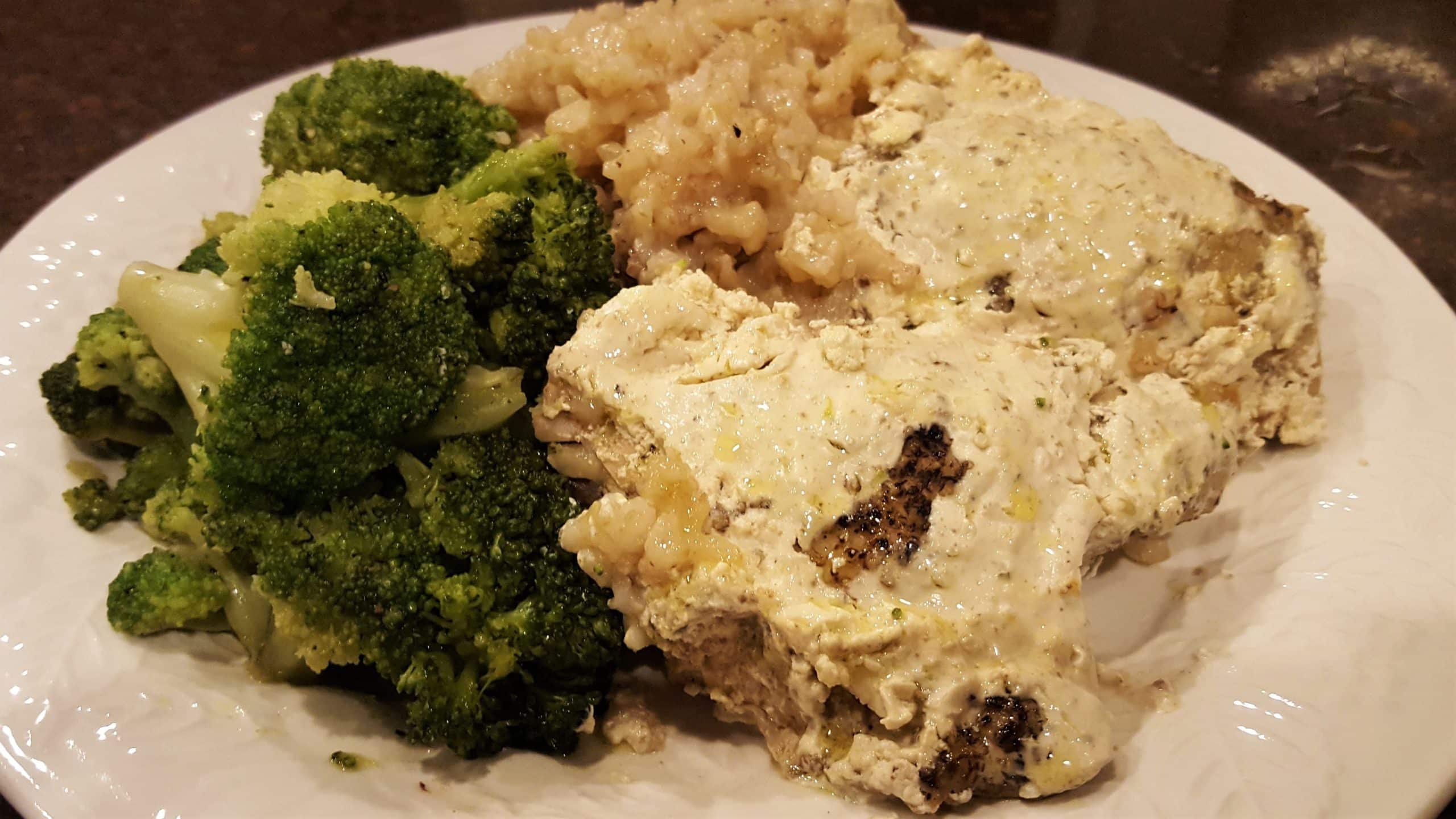 Delicious Creamy Garlic Sauce Smothered over Chicken Thighs and Rice! Slow Cooker Chicken - Dining in with Danielle