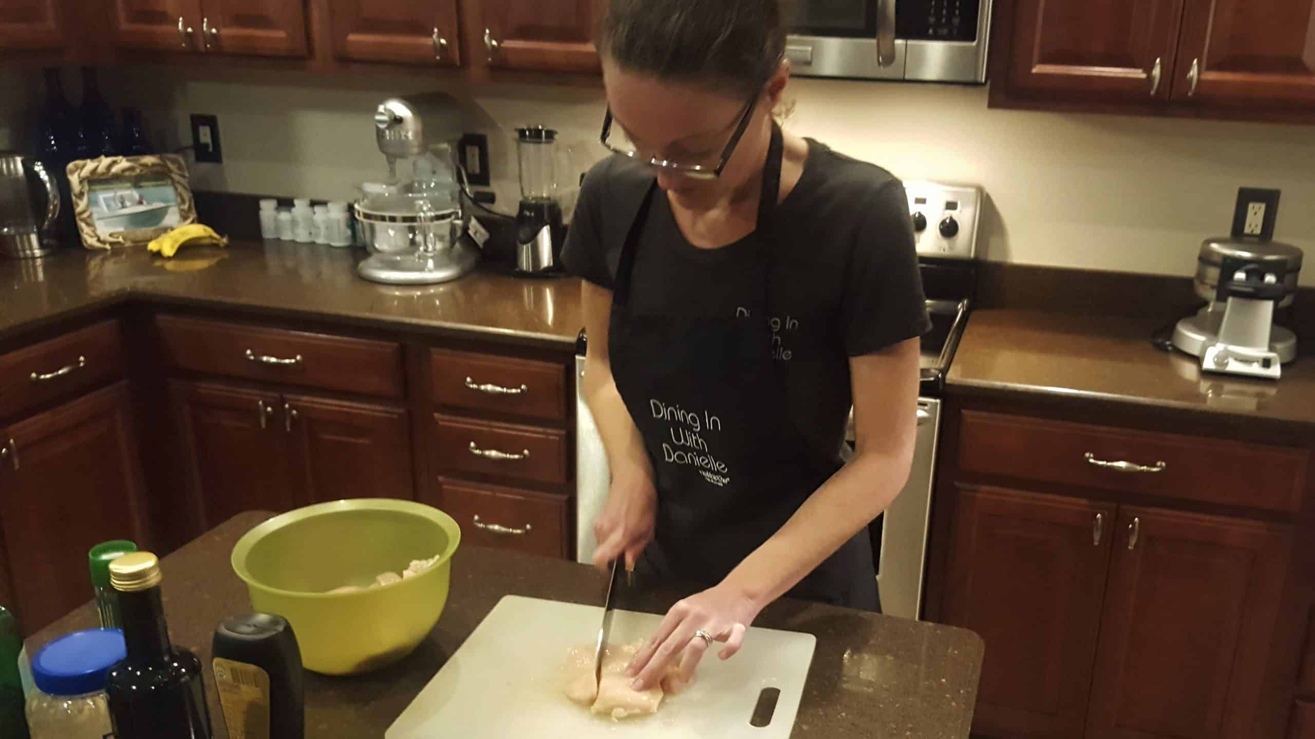 Me cutting up Chicken Breasts in to Strips, Making sure to cut Against the Grain! Cutting up Chicken Breast for Chicken Strips - Dining in with Danielle