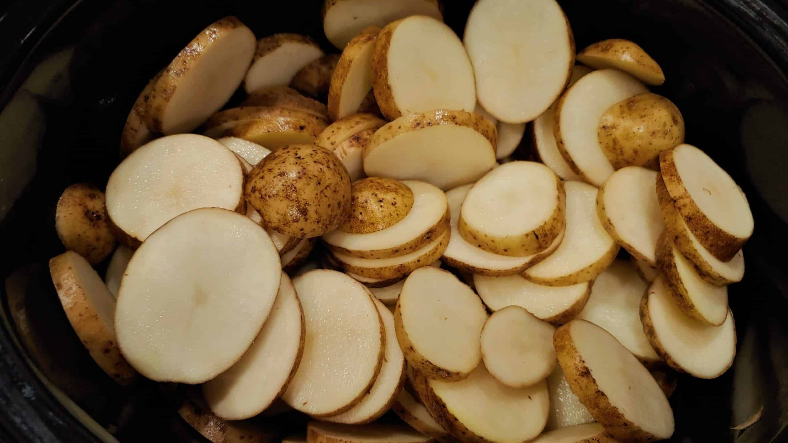 Potatoes sliced for Crock pot Scalloped Potatoes - Dining in with Danielle