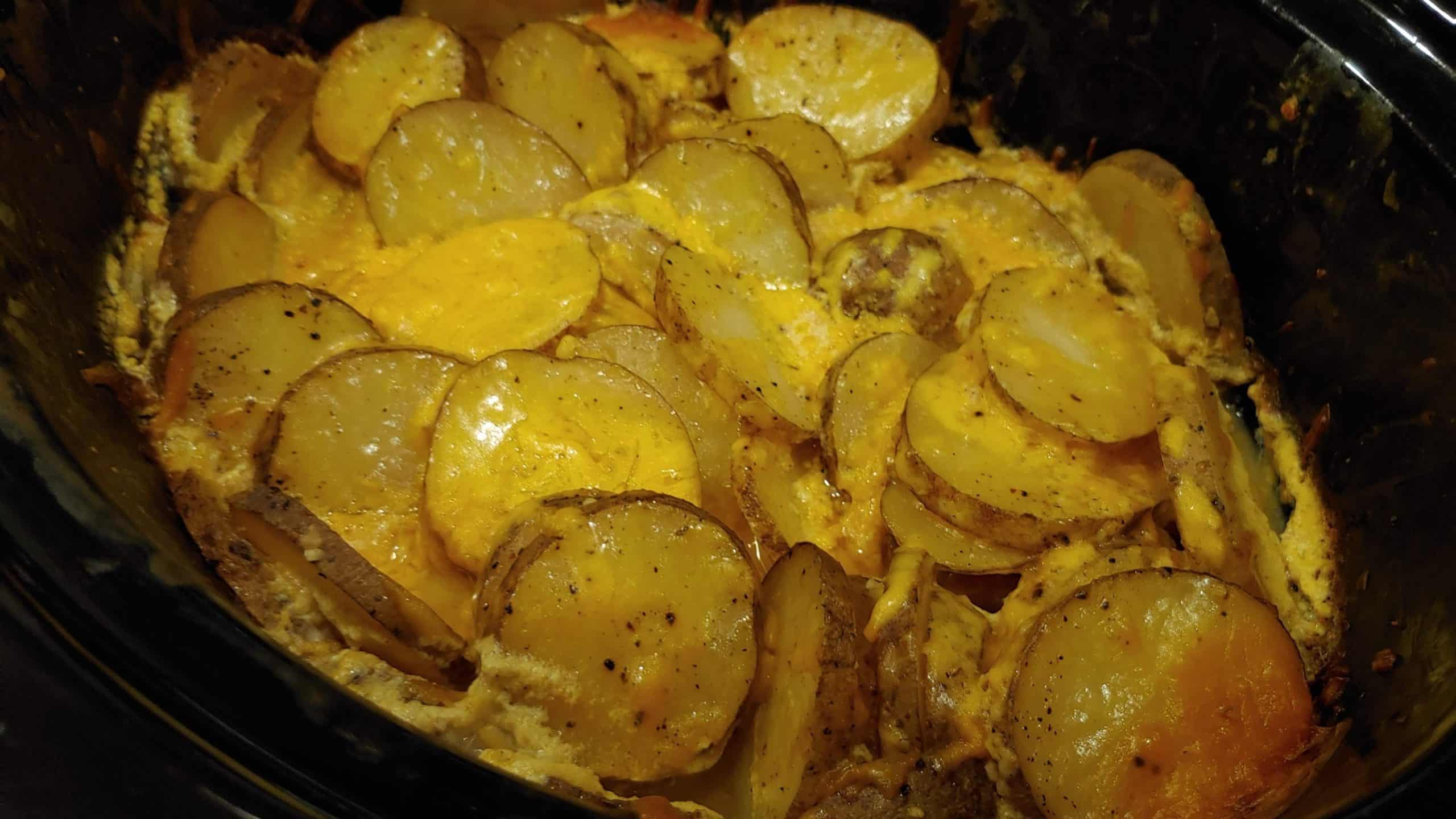 Serve these Delicious Cheesy Slow Cooker Scalloped Potatoes as a Meal or as a Side Dish! Slow Cooker Cheesy Garlic Scalloped Potatoes Dinner - Dining in with Danielle