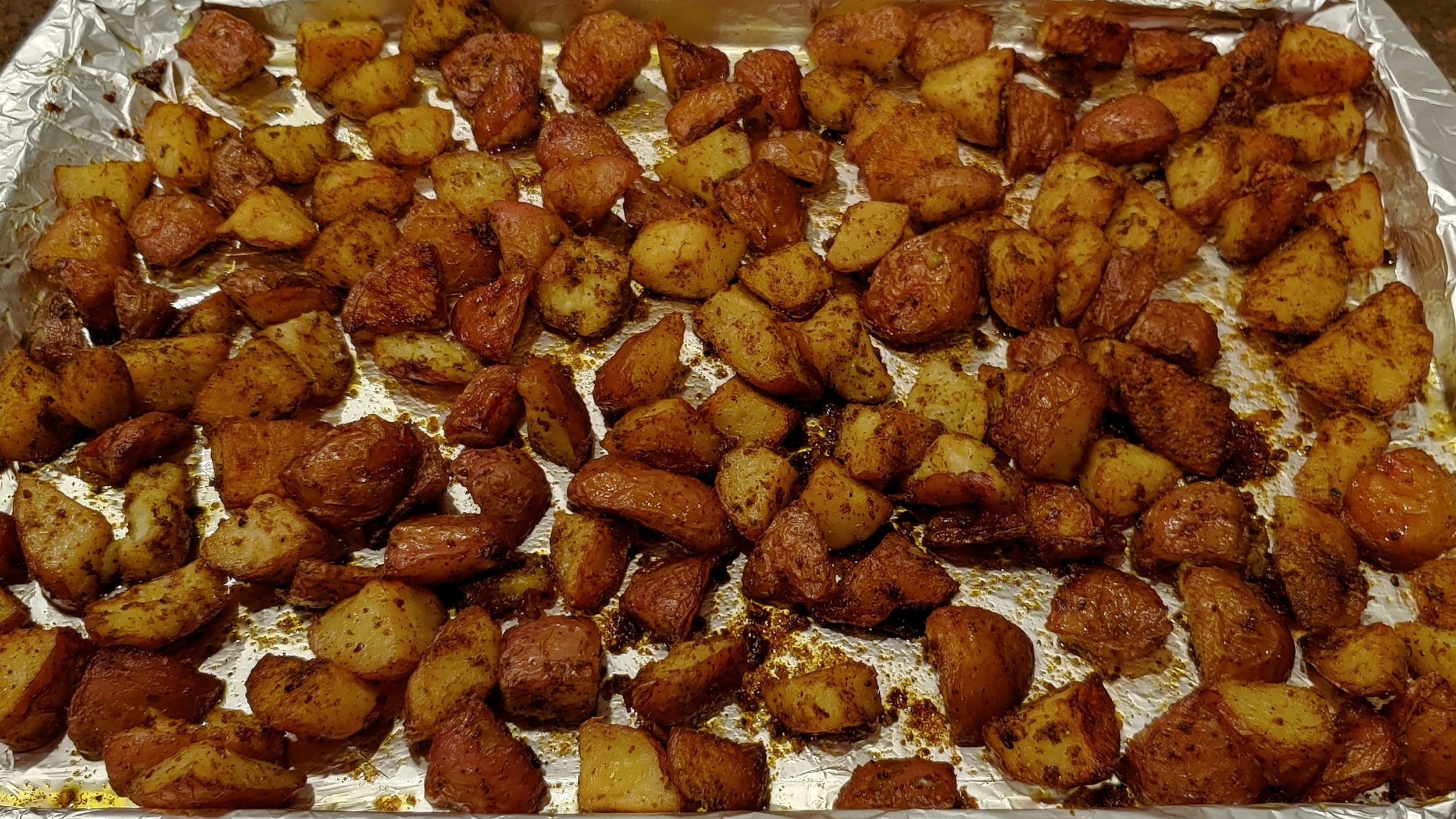Delicious Fried Spiced Potatoes Done in the Oven! Fried Potatoes - Dining in with Danielle