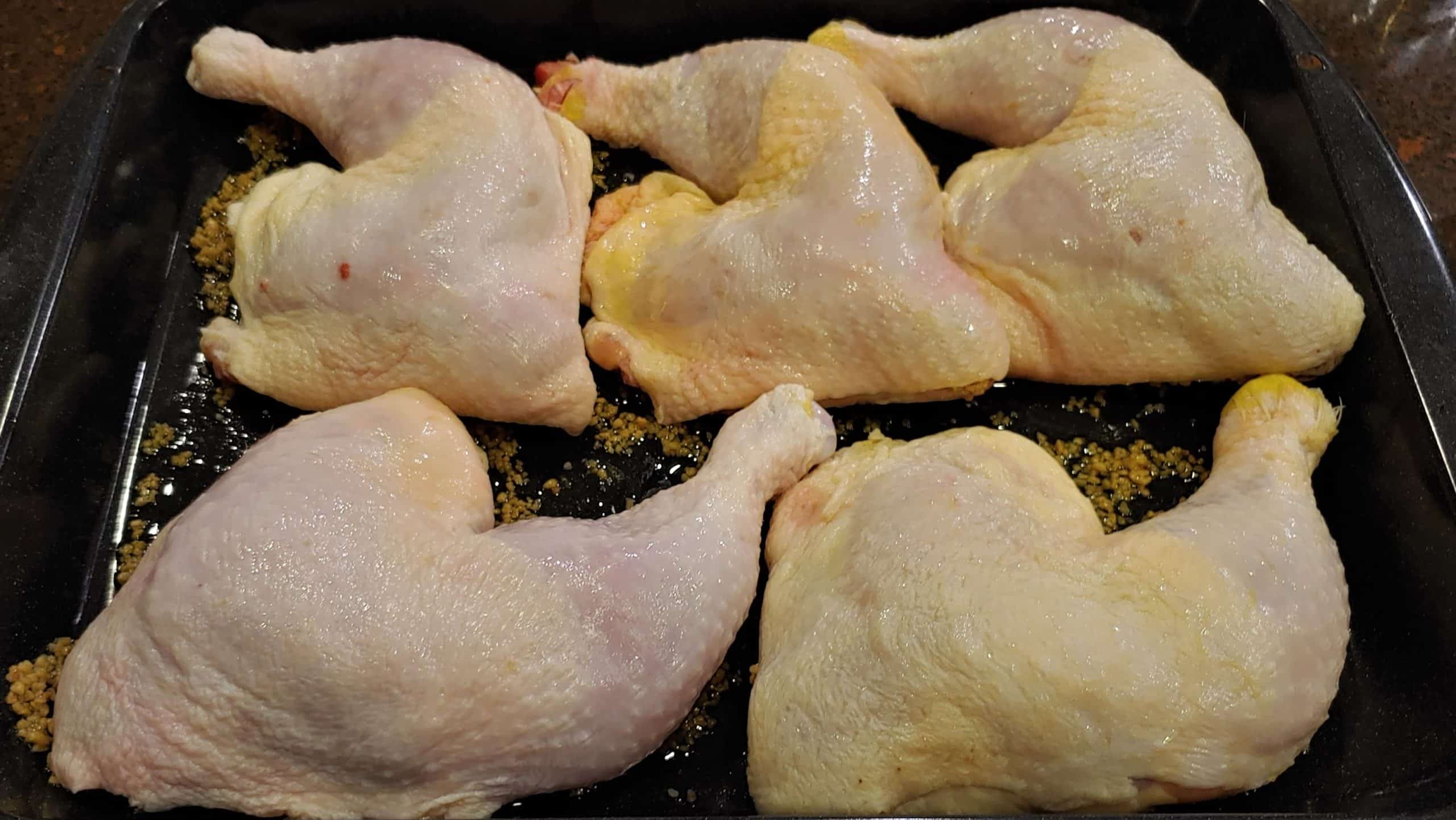 Skin On Chicken Leg Quarters before roasting - Dining in with Danielle